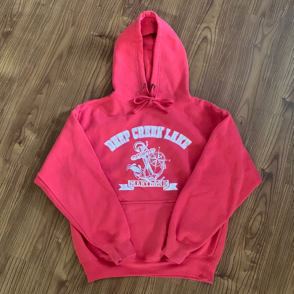 Deep Creek Lake Decal Hoodie. Made by Pacific & CO. Color is a Pinkish Red.